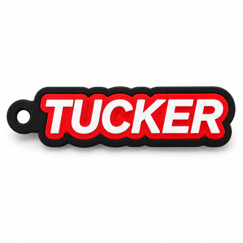Digital product preview of three-layer TUCKER name keychain with black backing red outline and white lettering
